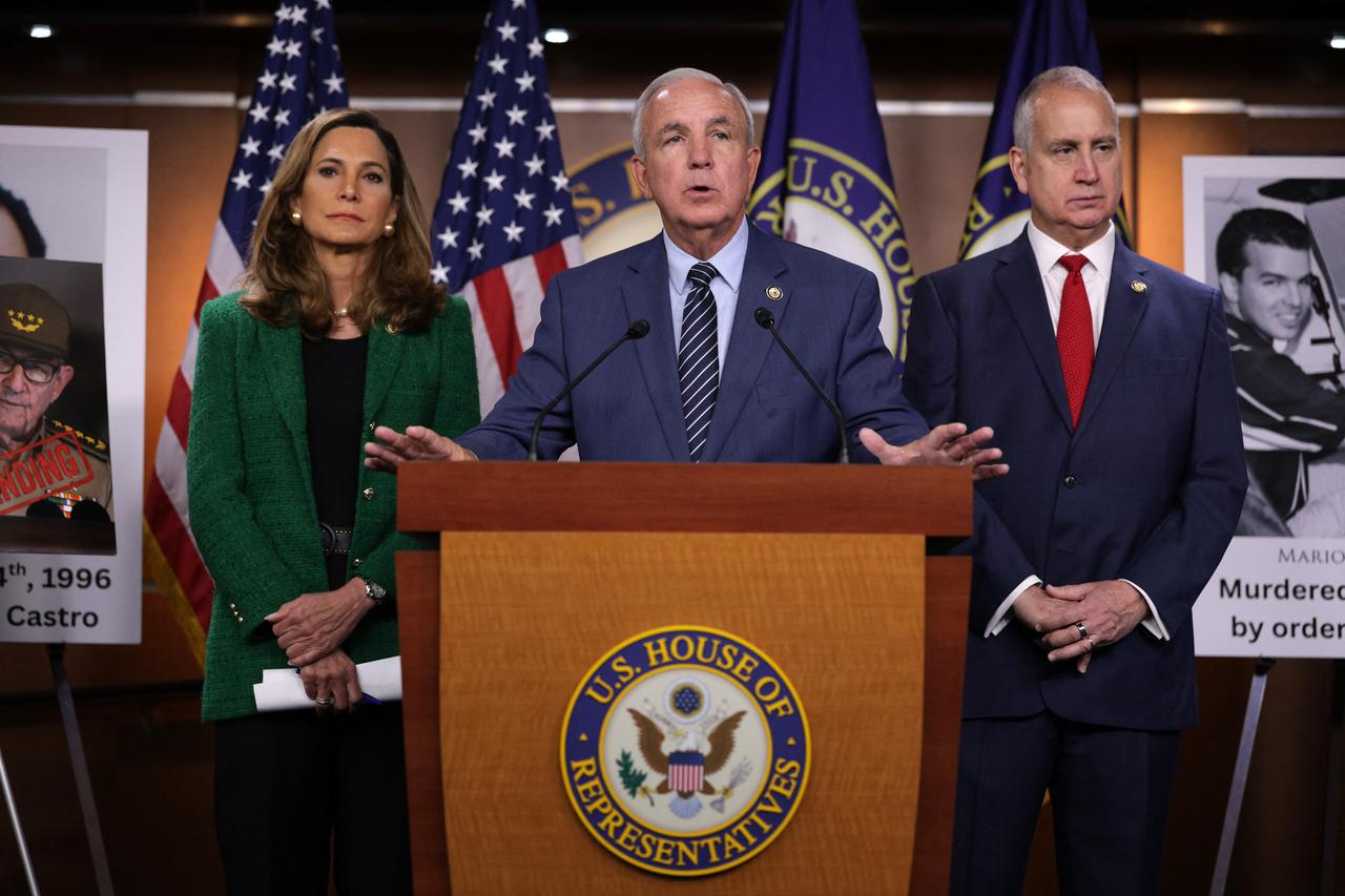 US Rep. Carlos Gimenez (C) speaks as Rep. Maria Salazar (L) and Rep. Mario Diaz-Balart (R) listen during a news conference on former Cuban President Raul Castro at the US Capitol on May 20, 2026 in Washington, DC. (AFP Photo)