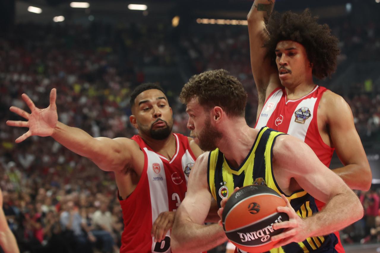 Fenerbahce Beko player Nicolo Melli (R) battles for the ball with Olympiakos player Tyson Ward during the EuroLeague Final Four semifinal at OAKA Arena in Athens, Greece, May 22, 2026. (AA Photo)