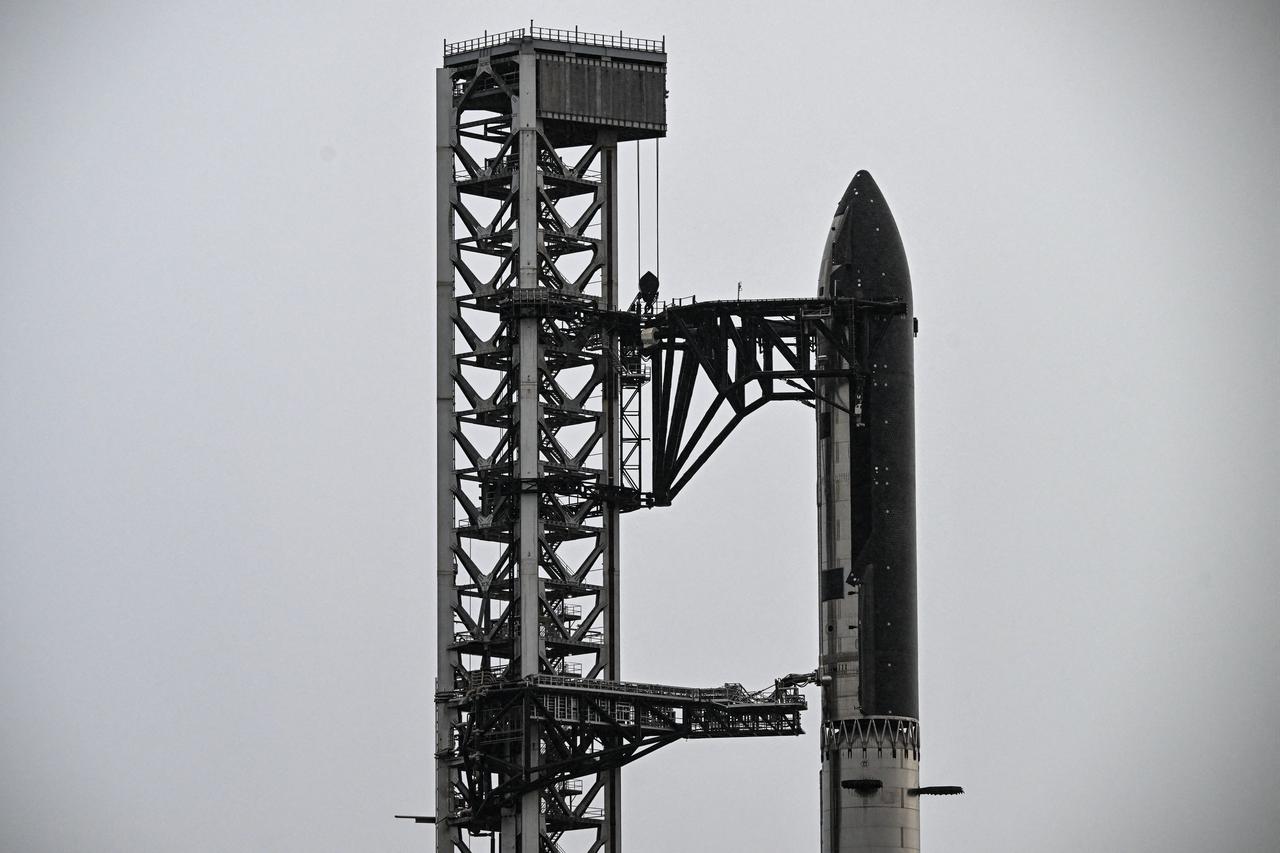 SpaceX's new Starship V3 rocket is seen docked at the Starbase during the 12th test flight on May 21, 2026 as seen from South Padre Island in Texas. (AFP Photo)