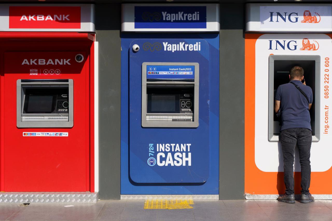 People use ATMs belonging to Turkish banks in Istanbul, Türkiye, Nov. 17, 2022. (Adobe Stock Photo)