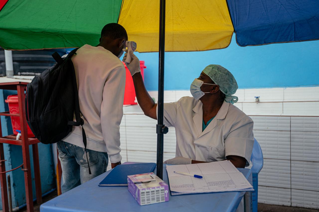 A visitor at the CBCA Virunga hospital has his temperature checked at a screening checkpoint set up at the hospital entrance as part of Ebola prevention measures in Goma, May 21, 2026. (AFP Photo)