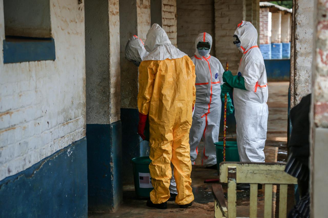 Health workers wearing protective equipment disinfect the isolation area for Ebola patients at the General Referral Hospital of Mongbwalu in Mongbwalu, DR Congo, May 23, 2026. (AFP Photo)