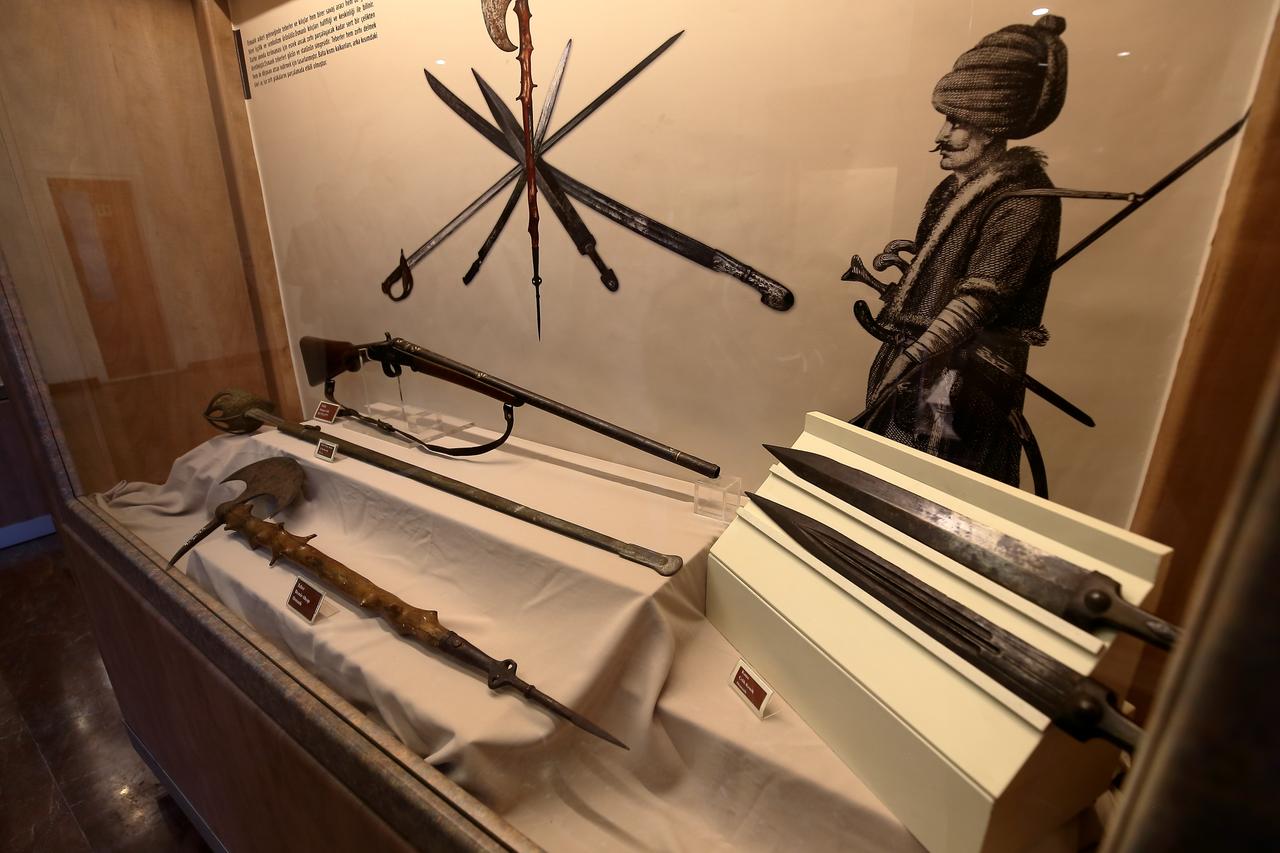 Weapons from different periods are displayed in a showcase at the “From Spear to Gunpowder” exhibition at Corum Museum in Corum, Türkiye, May 22, 2026. (AA Photo)