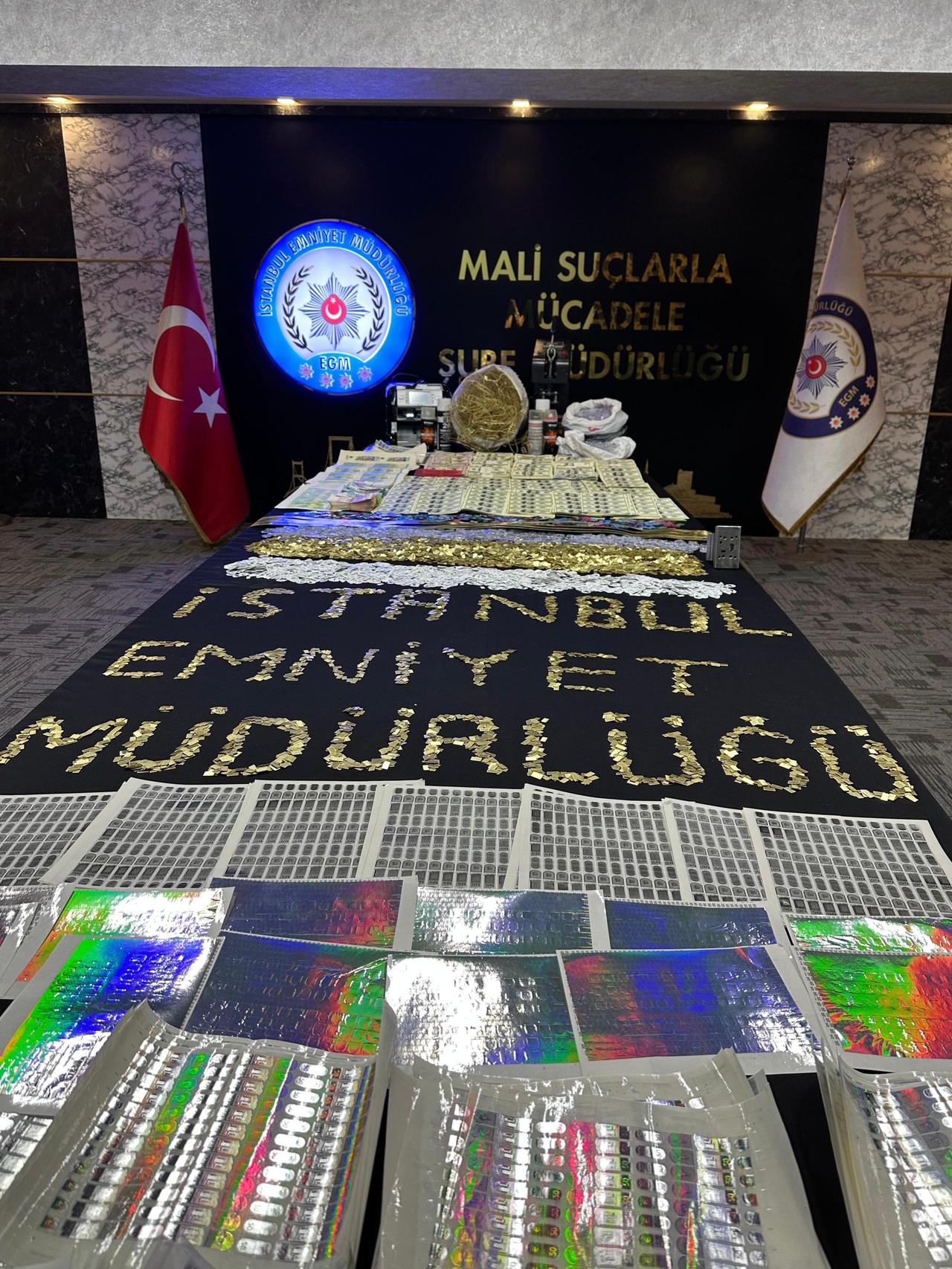 Fake U.S. dollars, euros, counterfeit gold and equipment seized by Istanbul police are displayed after a financial crimes operation in Istanbul, Türkiye, May 23, 2026. (AA Photo)
