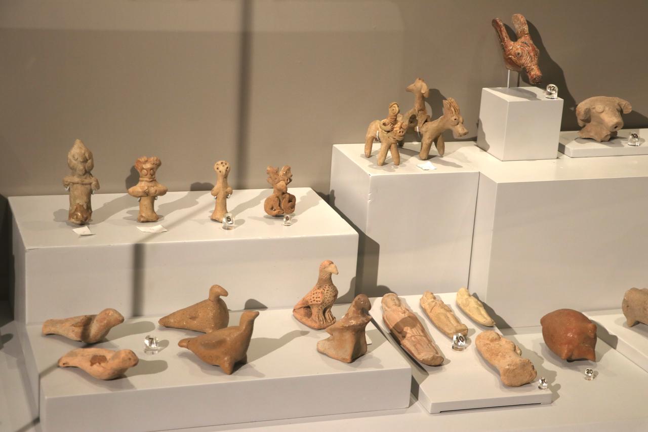 Terracotta figurines and small artifacts are displayed at Gaziantep Archaeology Museum, Gaziantep, Türkiye, May 22, 2026. (AA Photo)