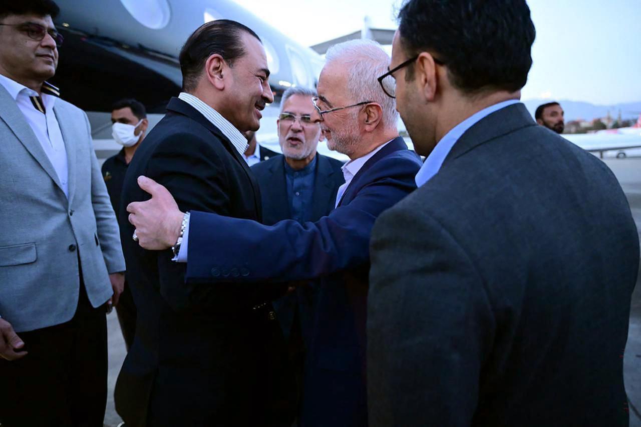 This handout photograph, taken and released on May 22, 2026, shows visiting Pakistan’s Army Chief Syed Asim Munir (2nd L) being greeted by Iran’s Interior Minister Eskandar Momeni upon his arrival in Tehran (Photo via Handout/Inter-Services Public Relations/AFP)
