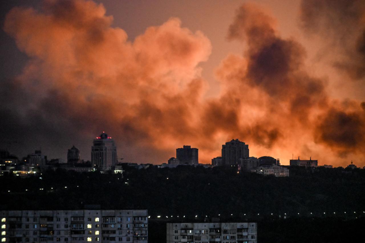 Smoke rises as the glow from fires lights the sky during a Russian strike on the Ukrainian capital Kyiv on May 24, 2026. (AFP Photo)