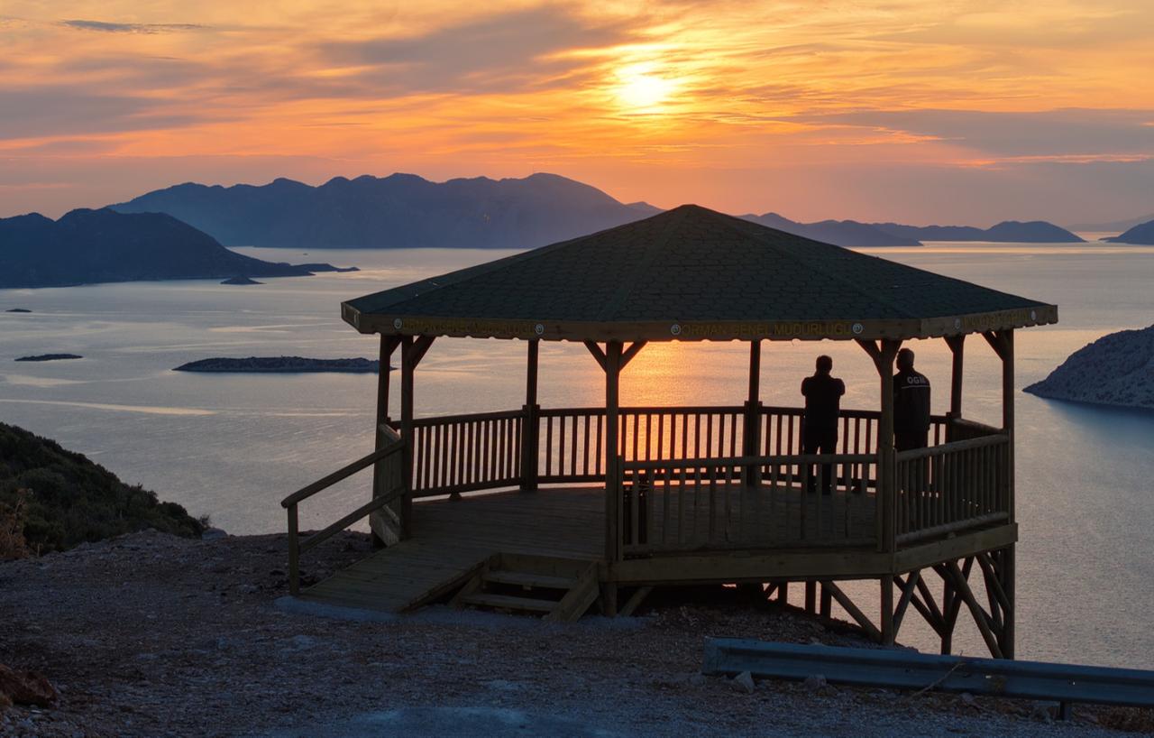 Visitors watch the sunset from the Taslica Viewpoint, part of the Carian Way and Phoenix Ecotourism Area project in Marmaris, Mugla, Türkiye. (AA Photo)