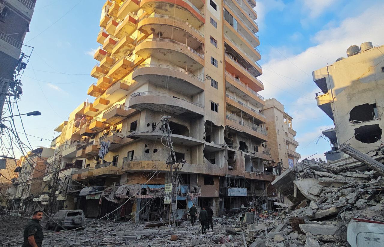 People inspect the site of an Israeli strike in the southern Lebanese coastal city of Tyre on May 23, 2026. (AFP Photo)