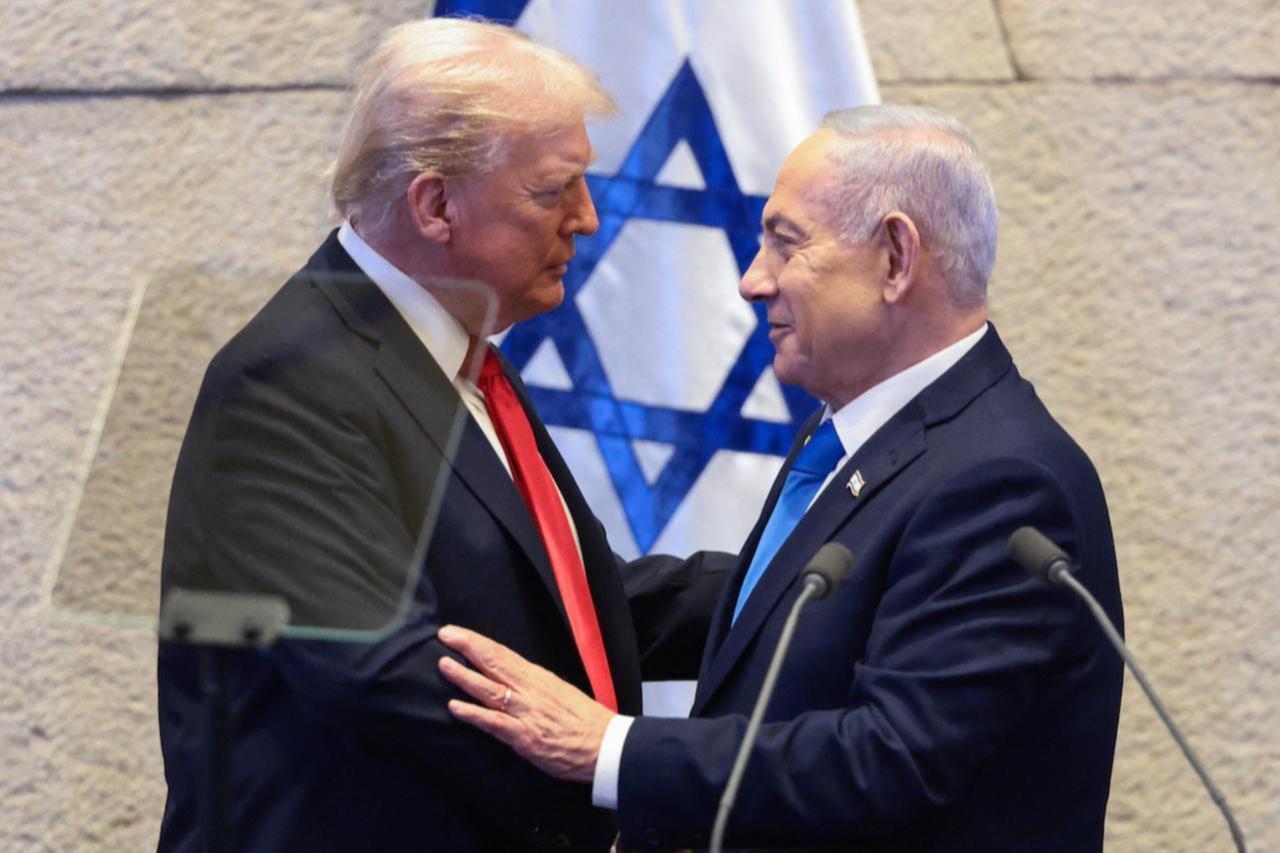 US President Donald Trump (L) speaks with Israeli Prime Minister Benjamin Netanyahu at the Israeli parliament, the Knesset, in Jerusalem on October 13, 2025. (AFP Photo)