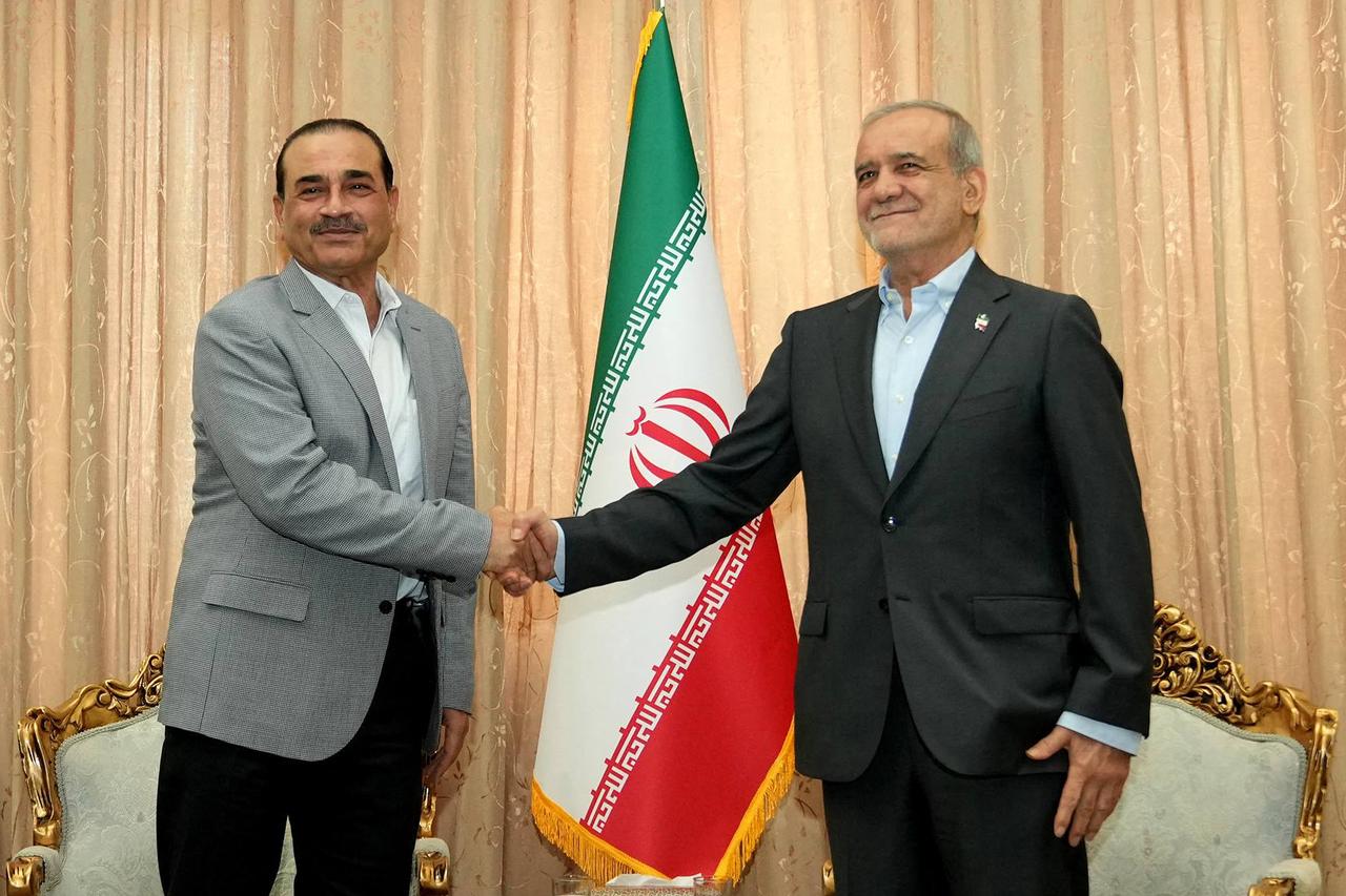 In this handout picture provided by the Iranian presidency, Iran's President Masoud Pezeshkian (R) meets with Pakistan’s Army Chief Syed Asim Munir in Tehran, Iran, May 23, 2026. (Photo by Iranian Presidency/HO/AFP)