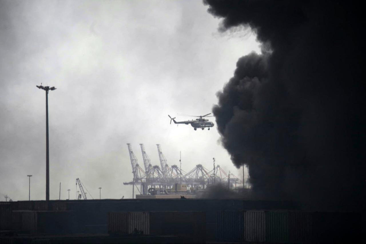 A helicopter flies above the smoke following an explosion at the Shahid Rajaee port dock southwest of Bandar Abbas in the Iranian province of Hormozgan, Iran, April 26, 2025. (AFP Photo)