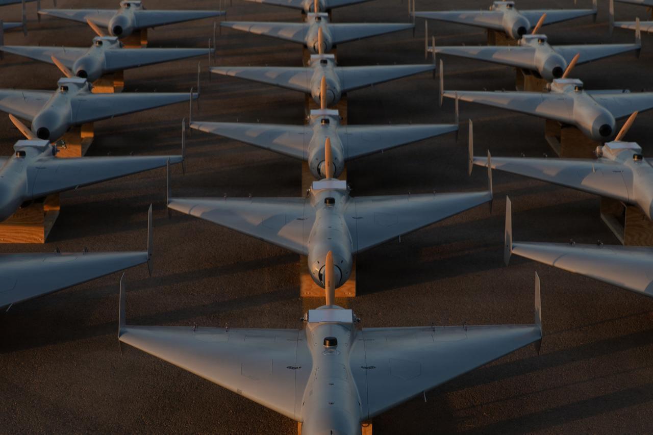 Low-cost Unmanned Combat Attack System (LUCAS) drones are positioned on the tarmac at a base in the CENTCOM operating area, Nov. 23, 2025. (Photo via U.S. Central Command)