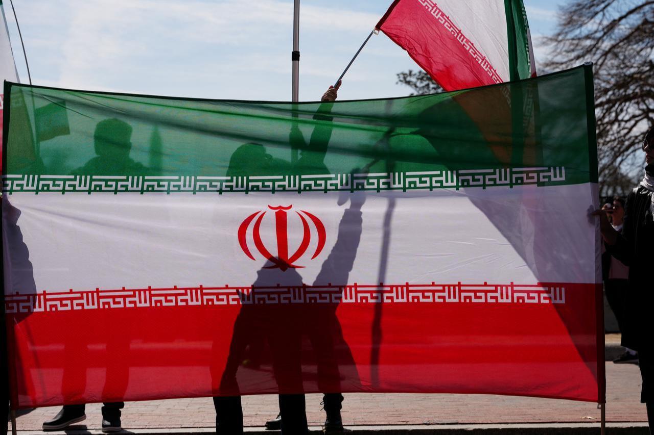 Protestors hold Iranian flags during the International Day of al-Quds (Jerusalem Day) in front of the White House in Washington, DC, March 14, 2026. (AFP Photo)