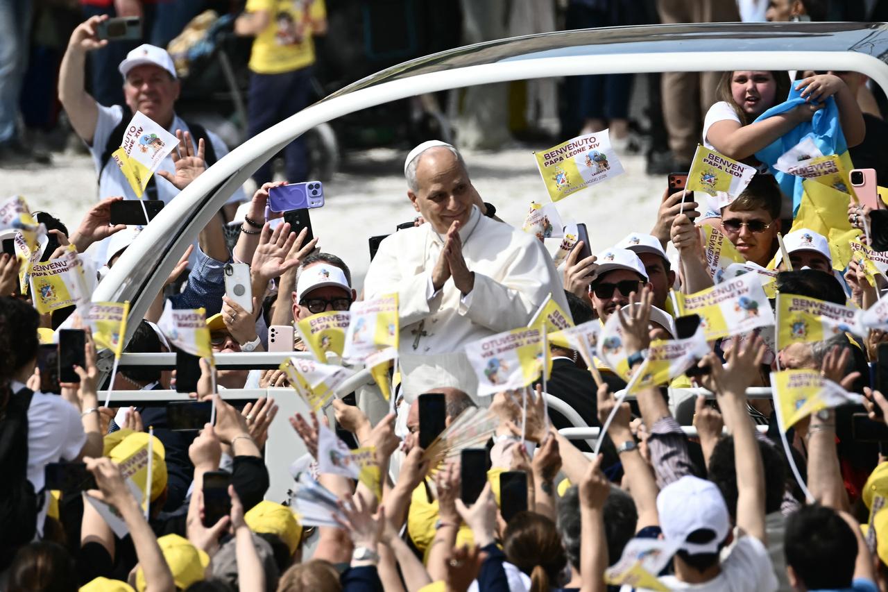 Pope Leo XIV greets the crowd from the popemobile at Piazza Nicola Calipari, May 23, 2026. (AFP Photo)