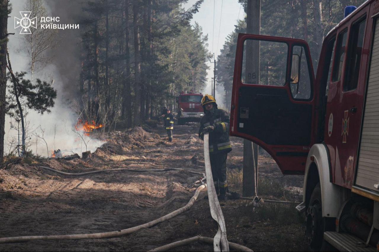 This handout photograph taken on May 7, 2026 released by the State Emergency Service of Ukraine on May 8, 2026, shows firefighters extinguishing a forest fire in the Chernobyl Exclusion Zone in northern Ukraine. (AFP Photo)
