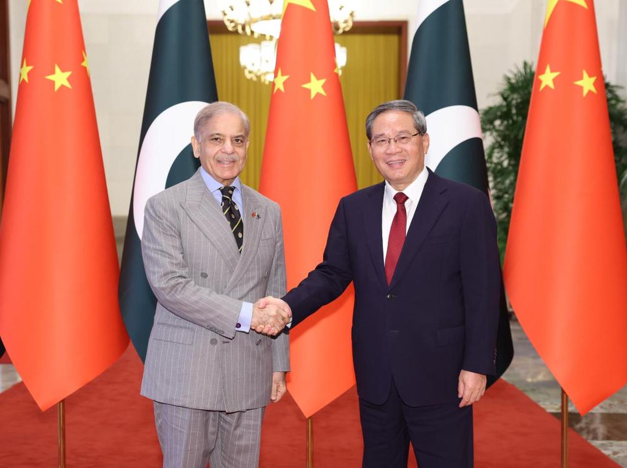 Chinese Premier Li Qiang (R) holds talks with Pakistani Prime Minister Shehbaz Sharif, who is on an official visit to China, at the Great Hall of the People in Beijing, China, May 25, 2026. (Photo via XINHUA/AFP)