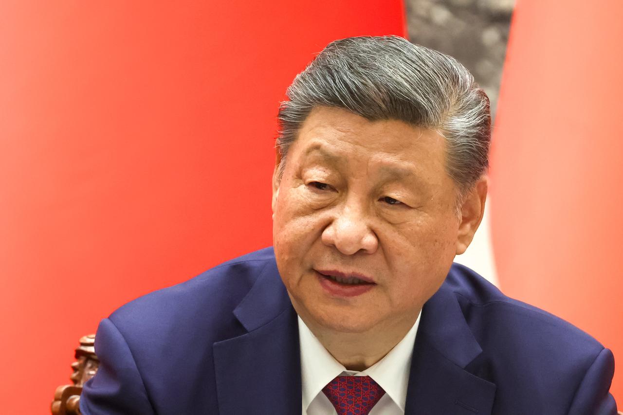 In this pool photograph distributed by the Russian state agency Sputnik, China's President Xi Jinping attends a signing ceremony with Russia's President following their talks in Beijing, China, May 20, 2026. (AFP Photo)