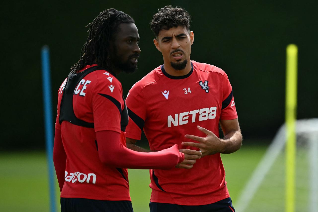 Crystal Palace's striker #29 Evann Guessand (L) and Crystal Palace's defender #34 Chadi Riad (R) in a team training session in London, England on May 21, 2026 (AFP Photo)