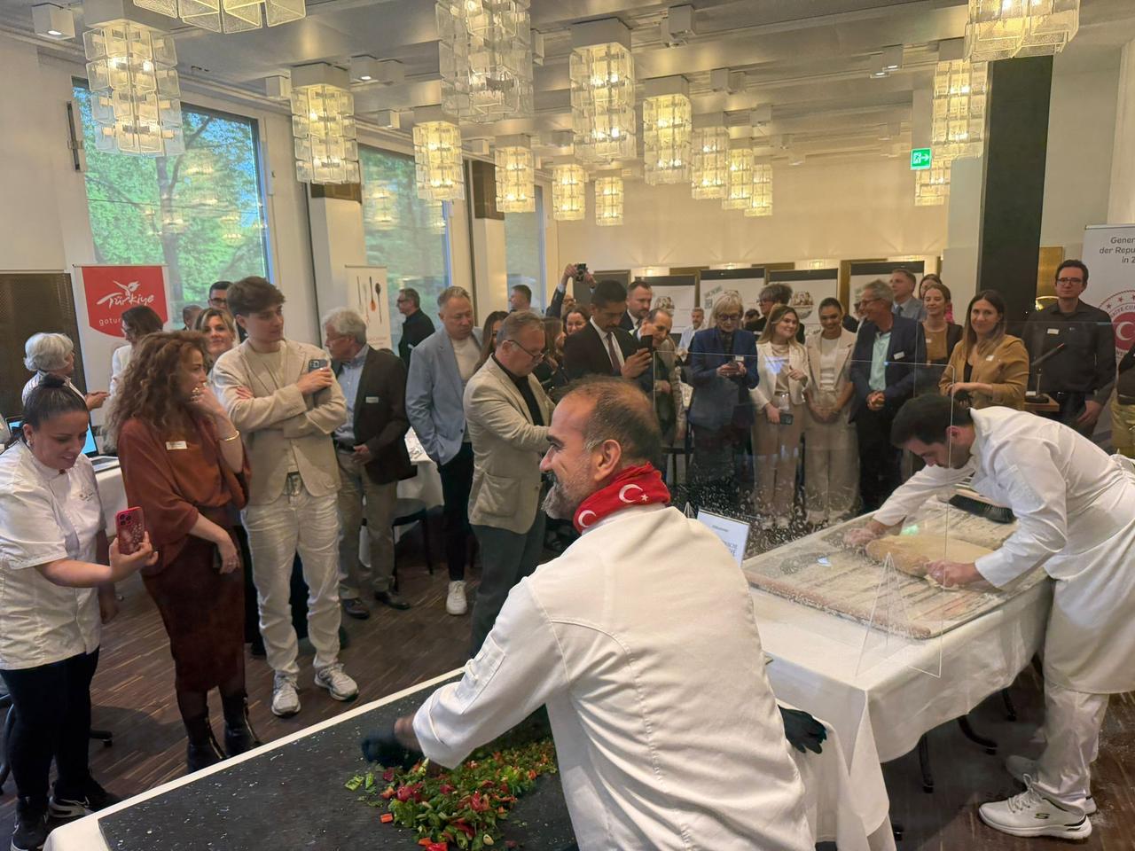 Chefs prepare traditional Turkish dishes during a Turkish Cuisine Week event in Zurich, Switzerland, May 21, 2026. (AA Photo)