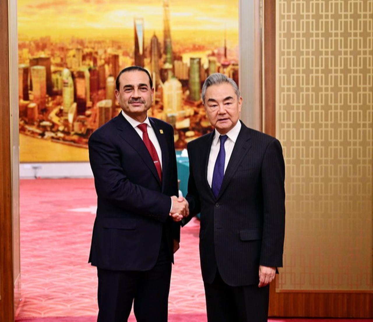 Chinese Foreign Minister Wang Yi (R) shakes hands with Pakistani Army Chief Field Marshal Asim Munir during a meeting in Beijing, China, on May 26, 2026. (Photo via Chinese Foreign Ministry)