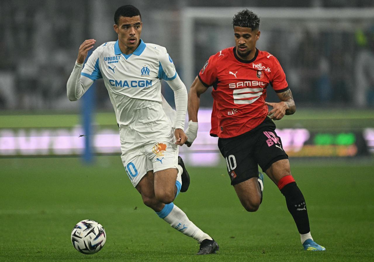 Marseille's English forward #10 Mason Greenwood (L) fights for the ball with Rennes' French forward #10 Ludovic Blas during the French L1 football match between Olympique de Marseille (OM) and Stade Rennais FC at the Stade Velodrome in Marseille, southern France, May 17, 2026. (AFP Photo)