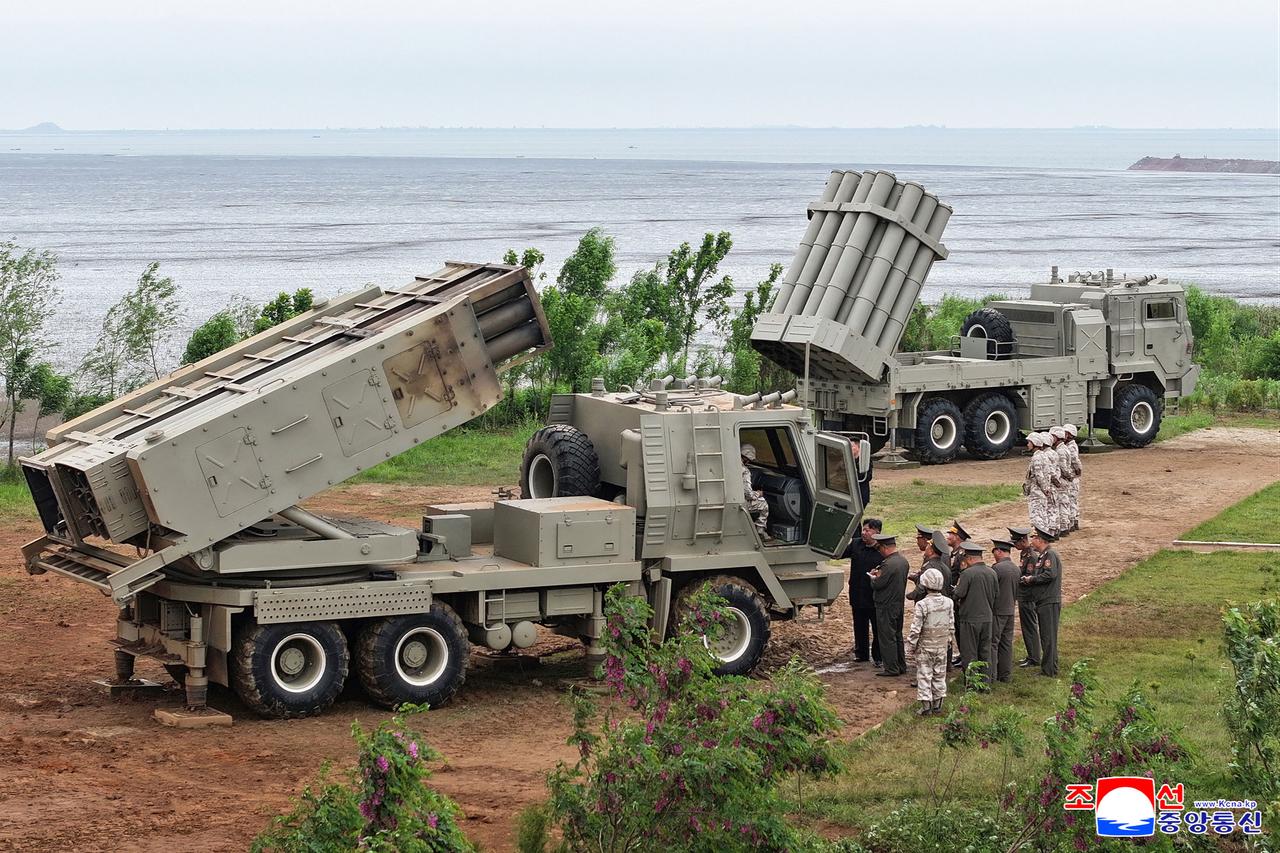 This picture taken on May 26, 2026 and released by North Korea's official Korean Central News Agency (KCNA) on May 27, 2026 shows North Korean leader Kim Jong Un inspecting tests of newly-developed lightweight multi-purpose missile launching system and multiple tactical cruise missile weapon system at an undisclosed location in North Korea. (Photo by KCNA VIA KNS/HO/AFP)