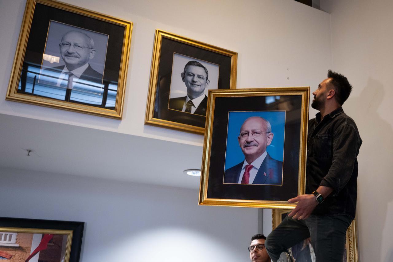 Portraits of reinstated CHP Chairman Kemal Kilicdaroglu and former chairman Ozgur Ozel are displayed at CHP headquarters in Ankara, Türkiye, on May 25, 2026, with Kilicdaroglu’s portrait appearing both as former and current party leader following his reinstatement. (AA Photo)
