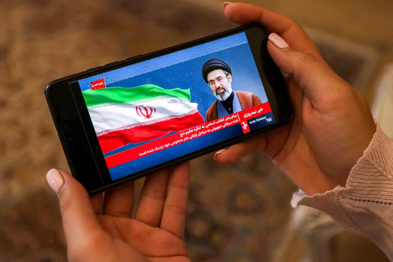 A woman watches a televised broadcast delivered on behalf of Iran's Supreme Leader Mojtaba Khamenei in Tehran on May 26, 2026. (AFP Photo)