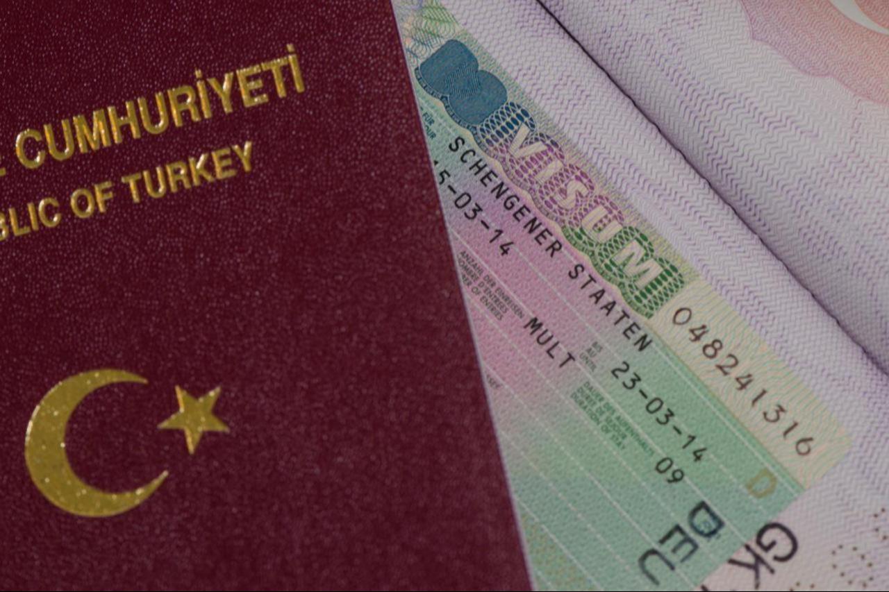 Turkish Passport and Schengen Visa on an undated photo. (Adobe Stock Photo)