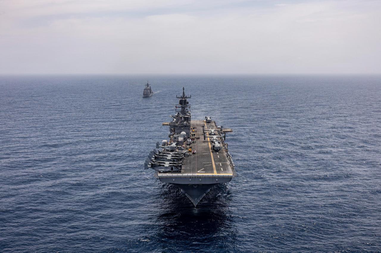 Wasp-class amphibious assault ship USS Iwo Jima (LHD 7) and Ticonderoga-class guided missile cruiser USS Lake Erie (CG 70), transit off the coast of Venezuela in the Caribbean Sea, May 23, 2026. (Photo via U.S. Navy)