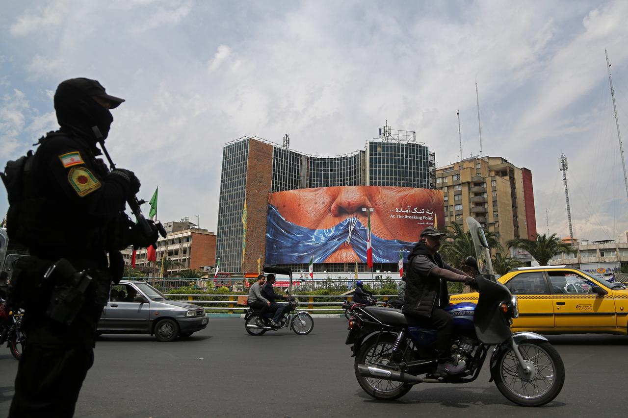 A giant banner depicting the Strait of Hormuz is displayed at Vali-e Asr Square, featuring the phrase "At the breaking point" in Tehran, Iran, May 2, 2026. (AA Photo)