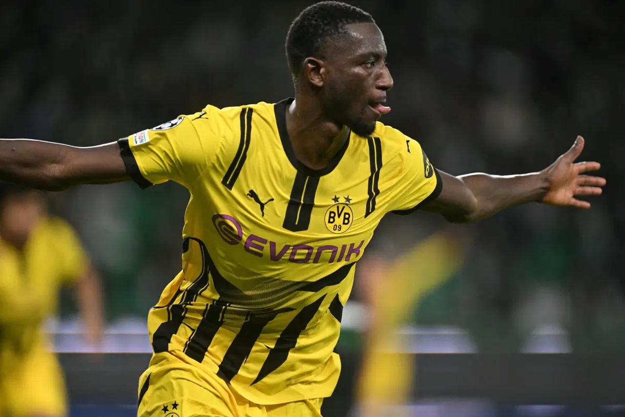 Borussia Dortmund’s Guinean forward #09 Sehrou Guirassy celebrates scoring his team’s first goal during the UEFA Champions League knockout phase play-off football match between Sporting CP and BVB Borussia Dortmund at Alvalade stadium in Lisbon, February 11, 2025. (AFP Photo)