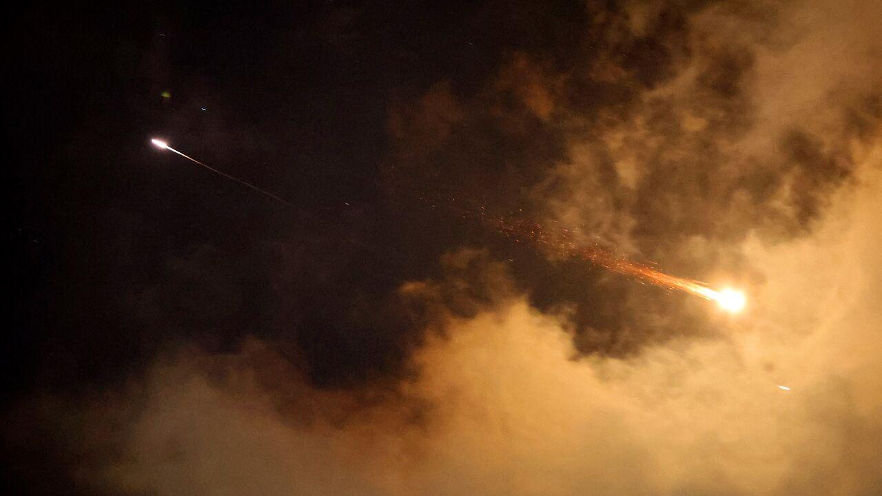 Rocket trails are seen in the sky above the Israeli coastal city of Netanya amid a fresh barrage of Iranian missile attacks on June 21, 2025. (AFP Photo)