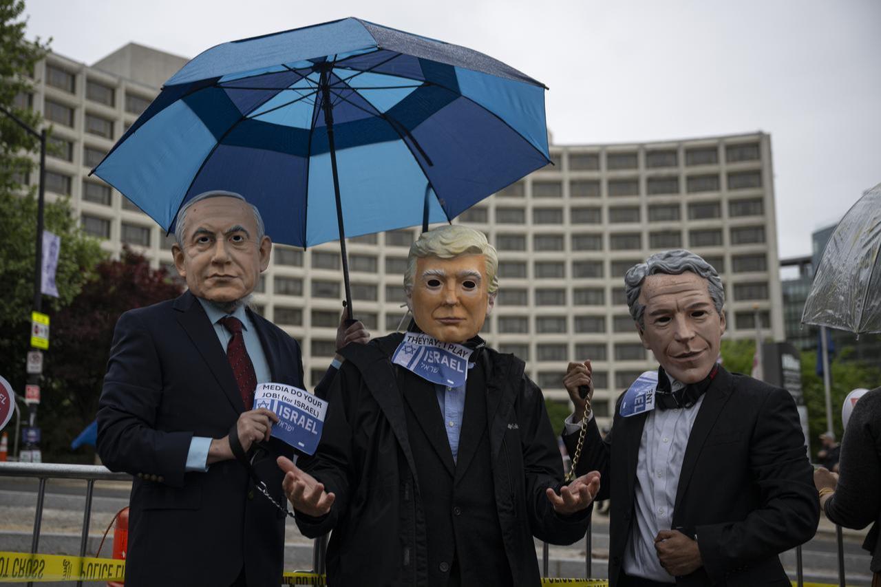 Protesters gather to protest the attacks in Gaza, Iran, Lebanon, and show support for Iranians, Palestinians, and Lebanese by chanting slogans outside the Washington Hilton in Washington, D.C., United States, April 25, 2026. (AA Photo)