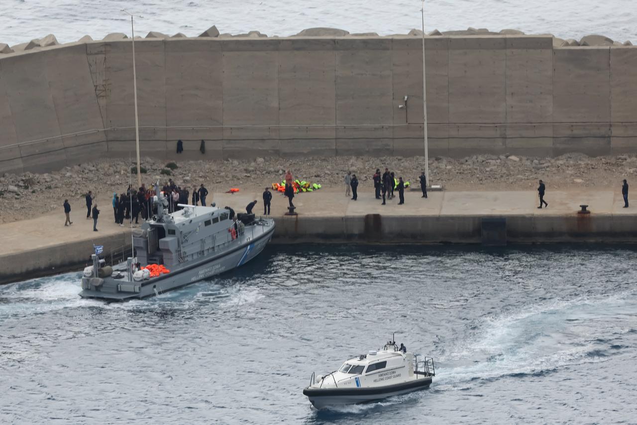 Activists from the Global Sumud Flotilla stand at the port of Atherinolakkos on the island of Crete after disembarking from a Greek Coast Guard vessel, following their interception by the Israeli Navy in international waters, May 1, 2026. (AFP Photo)