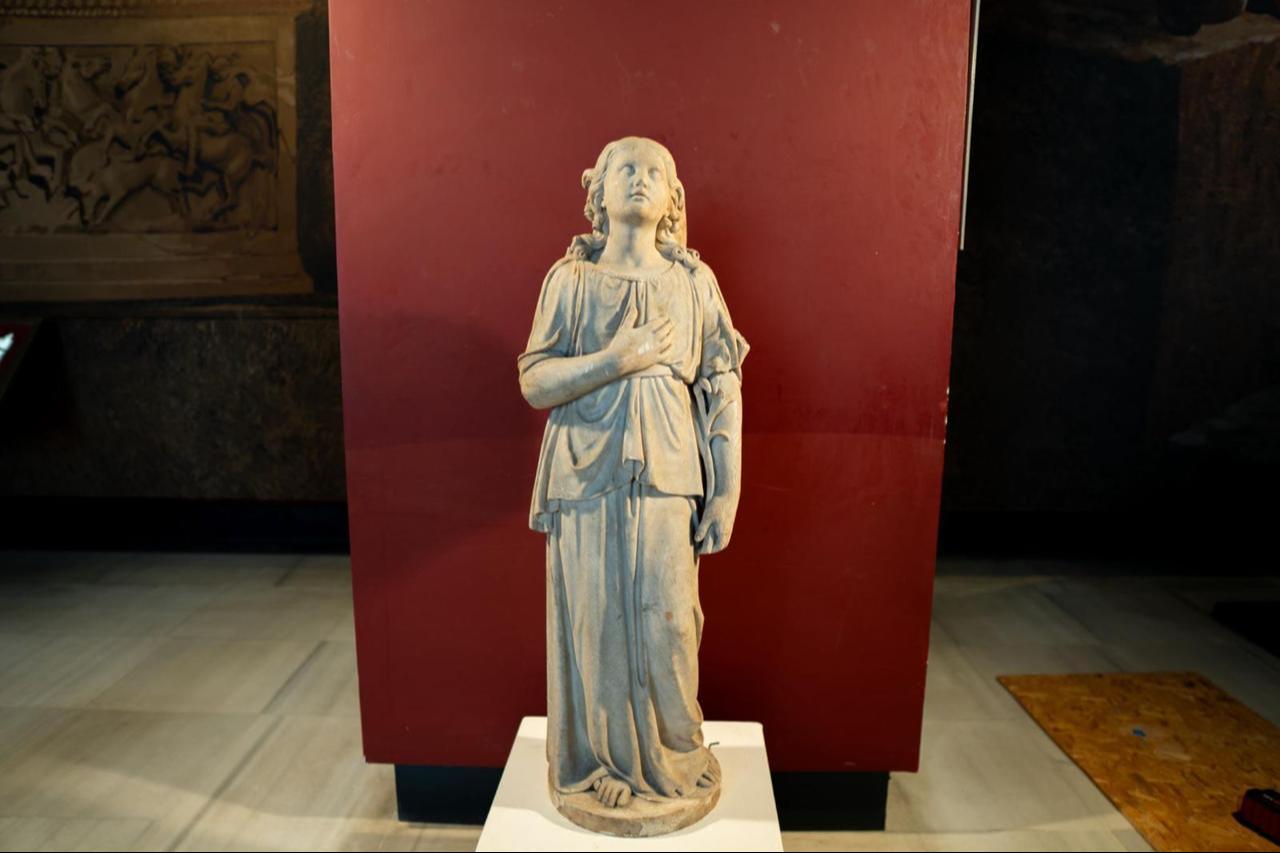 The recovered “angel statue,” originally stolen from Aya Yorgi Monastery in Heybeliada, is displayed during the ceremony in Istanbul, Türkiye, March 27, 2026. (AA Photo)
