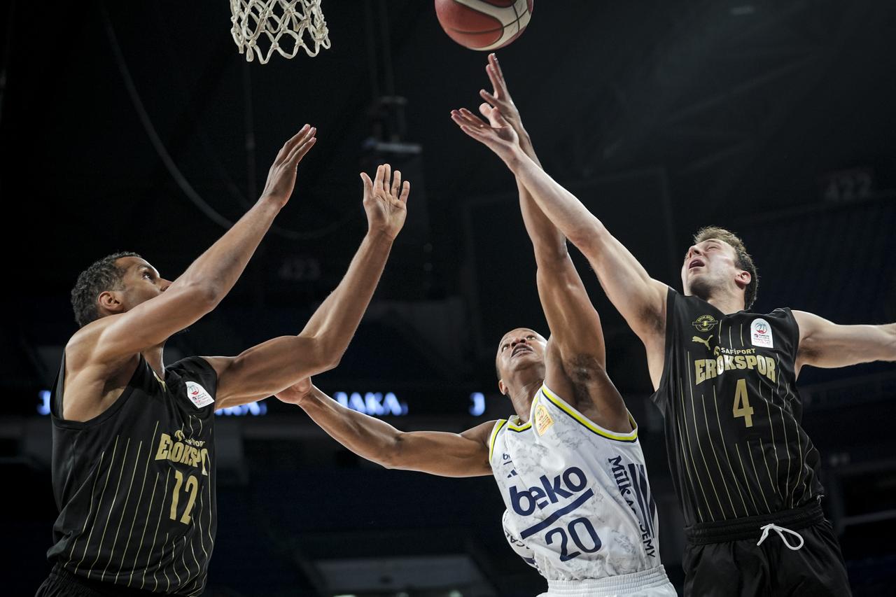 Fenerbahce Beko’s Devon Hall (20) and Safiport Erokspor’s Kevin Pangos (4) compete for the ball during the Basketball Super League playoff quarterfinal series game between Safiport Erokspor and Fenerbahce Beko at Sinan Erdem Sports Hall in Istanbul, Türkiye, May 29, 2026. (AA Photo)