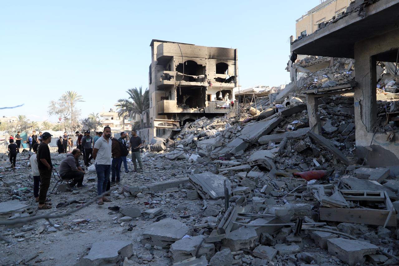 Palestinians inspect the scale of destruction following the Israeli attack on a building in Deir al-Balah, Gaza, Palestine, on May 24, 2026. (AA Photo)