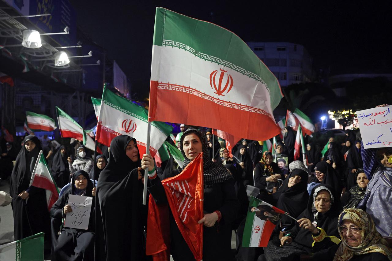 Women wave Iran's national flags during an anti-US and Israel protest in Tehran on May 29, 2026. (AFP Photo)