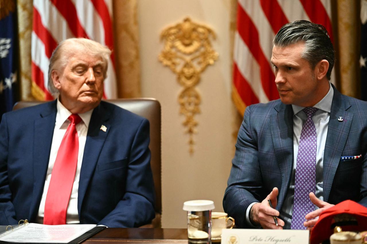 US President Donald Trump listens to Defense Secretary Pete Hegseth speak during a cabinet meeting in the Cabinet Room of the White House in Washington, DC, May 27, 2026. (AFP Photo)