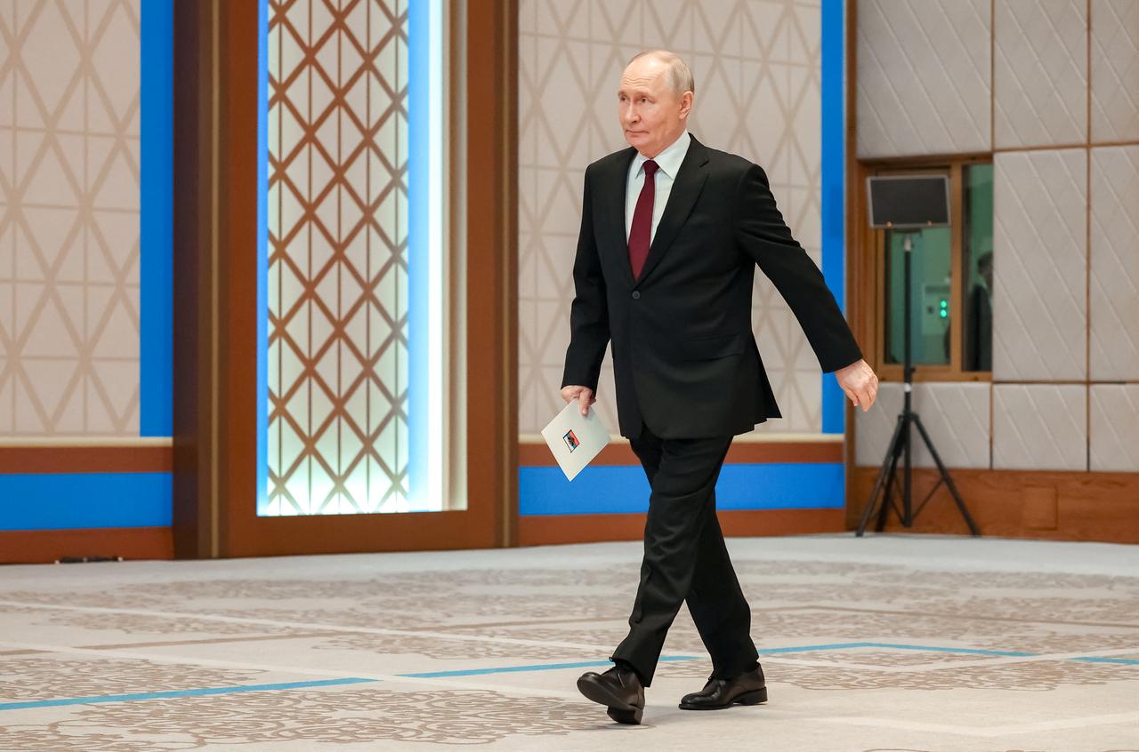 In this pool photograph distributed by the Russian state agency Sputnik Russia's President Vladimir Putin arrives to address a press-conference during his state visit to Kazakhstan at the Palace of Independence in Astana on May 29, 2026. (AFP Photo)
