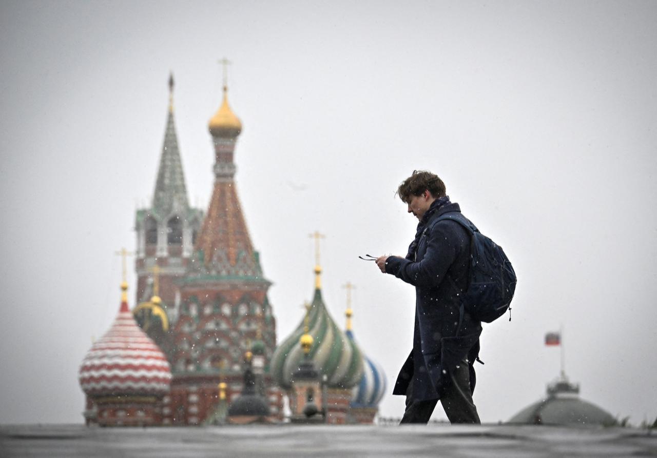 A man walks in front of St. Basil's Cathedral in downtown Moscow on April 10, 2026. (AFP Photo)