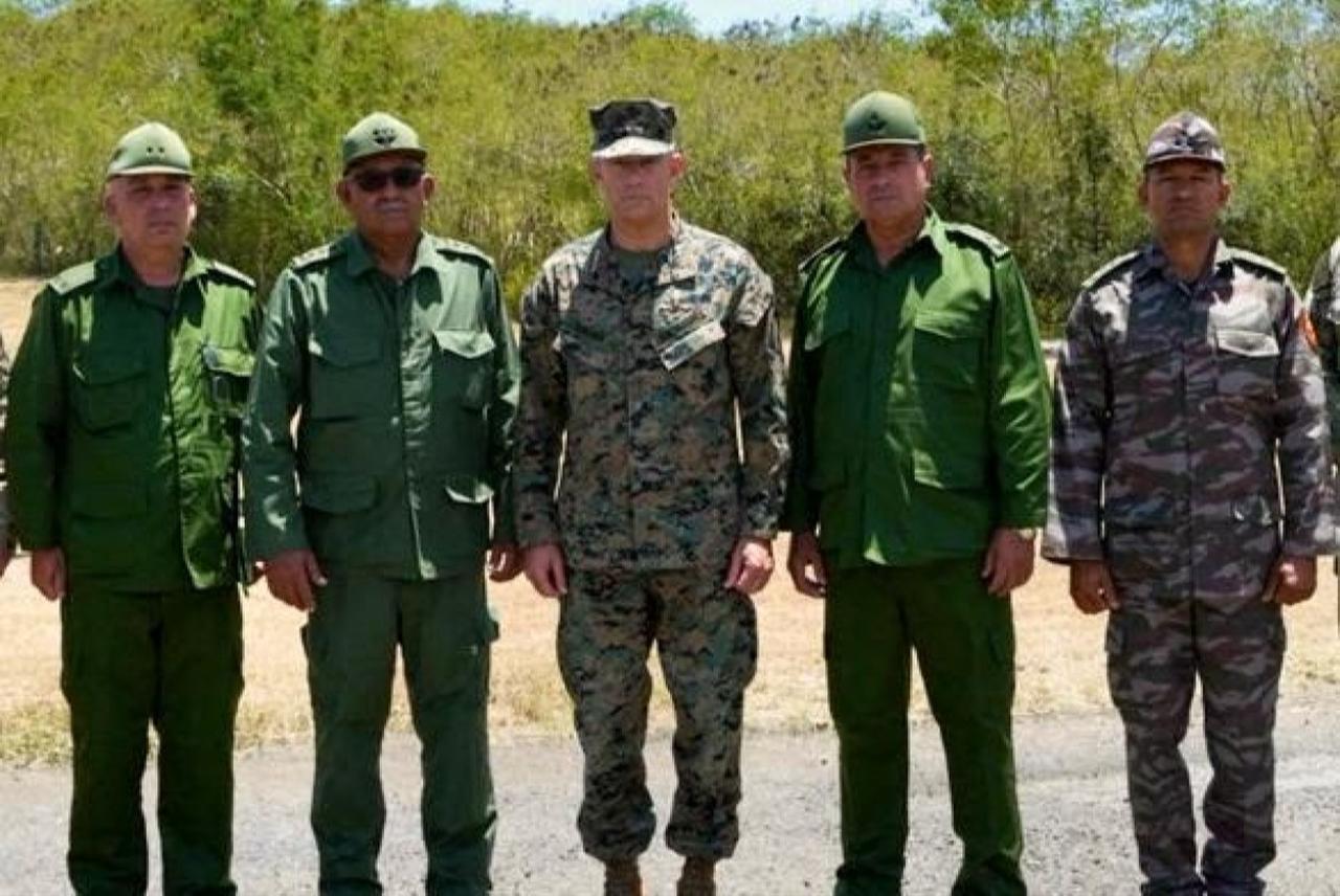 This photo posted on the X account of the US Southern Command (SOUTHCOM) on May 29, 2026, shows SOUTHCOM Commander General Francis L. Donovan (C), the Chief of the General Staff and First Deputy Minister of Cuba's Revolutionary Armed Forces (MINFAR) General Roberto Legra Sotolongo (2nd/L) and other Cuban military officials, during their meeting at the perimeter of the US Naval Station in Guantanamo Bay, Cuba, on May 29, 2026. (AFP Photo/US Southern Command X account Handout)