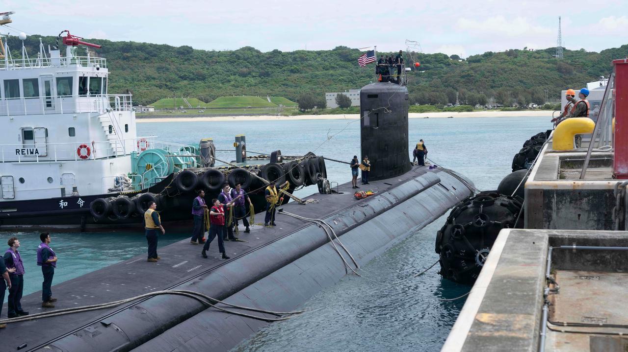 Sailors assigned to Virginia-class fast-attack submarine USS Minnesota (SSN 783) cast heaving lines as the ship prepares to moor to pierside onboard White Beach Naval Facility during a port visit, May 15, 2026. (Photo via U.S. Navy)
