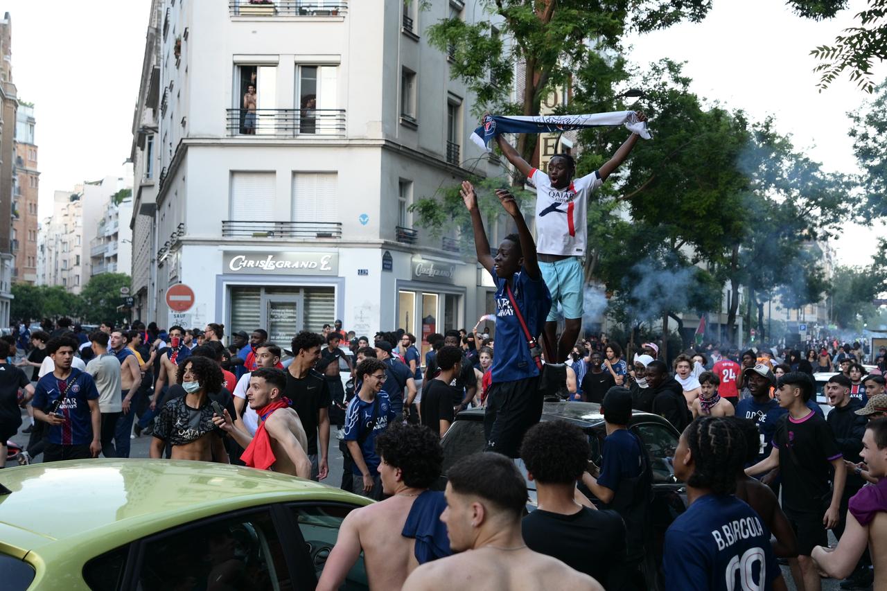 Paris Saint-Germain (PSG) supporters clash with police during celebrations following the team's UEFA Champions League victory in Paris, France, May 30, 2026. (AA Photo)