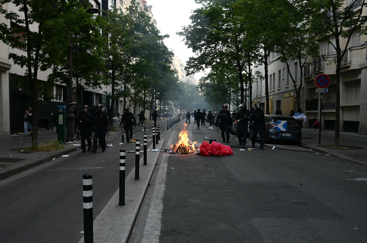 Paris Saint-Germain (PSG) supporters clash with police during celebrations following the team's UEFA Champions League victory in Paris, France, May 30, 2026. (AA Photo)