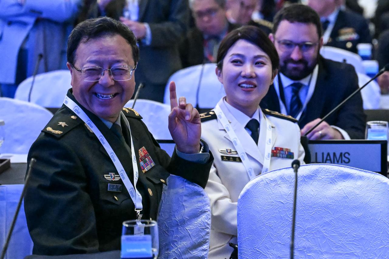 China's Major General Meng Xiangqing (L) of the National Defense University, the head of the Chinese delegation, gestures as he attends the fifth plenary session of the 23rd Shangri-La Dialogue summit in Singapore, May 31, 2026. (AFP Photo)