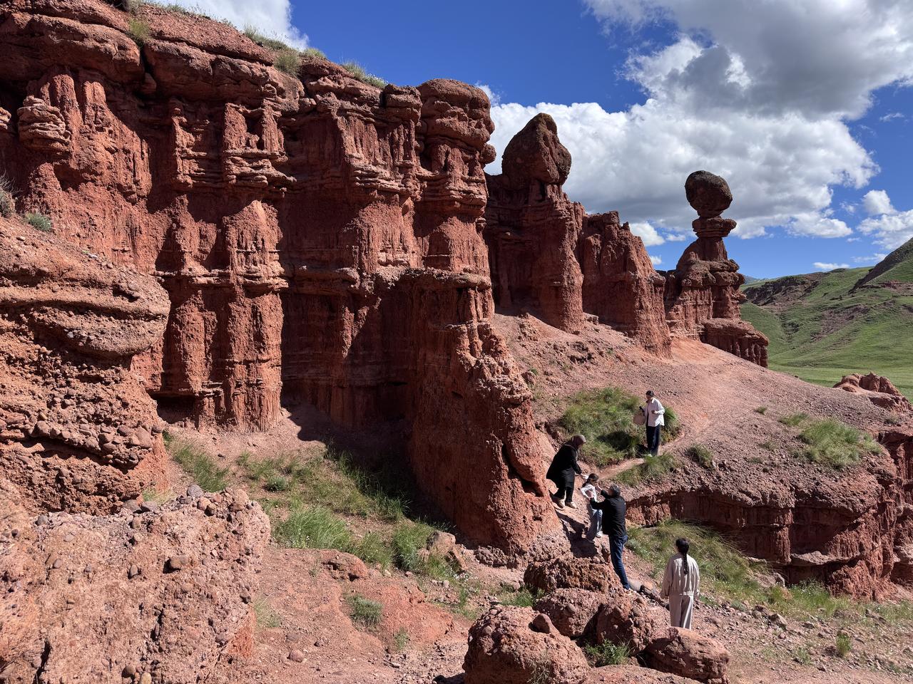 Visitors explore the Narman Fairy Chimneys, known as the “Land of Red Fairies,” in Erzurum, eastern Türkiye, May 30, 2026. (AA Photo)