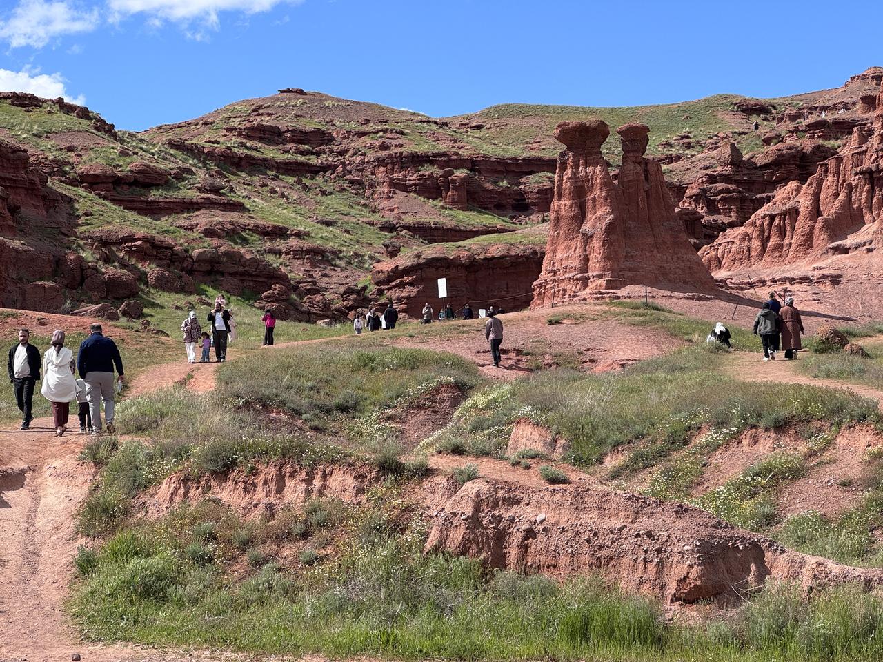 Visitors explore the Narman Fairy Chimneys, known as the “Land of Red Fairies,” in Erzurum, eastern Türkiye, May 30, 2026. (AA Photo)